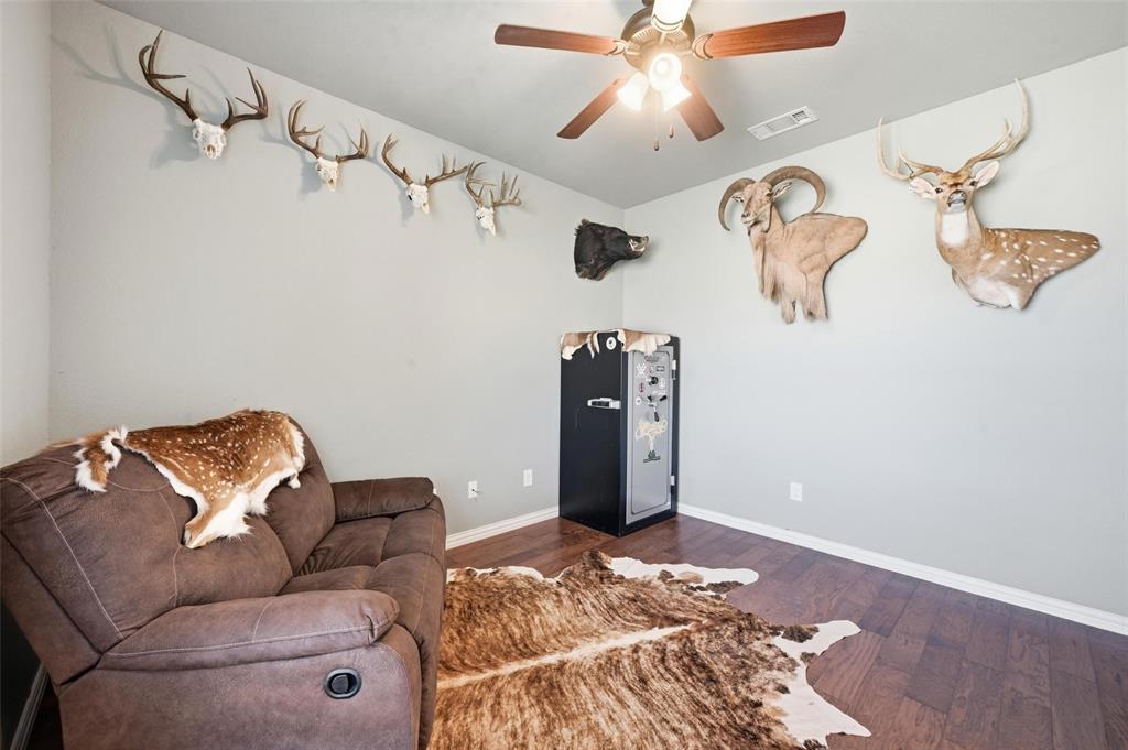144 Brady Coleman Lane Springtown, TX 76082 - Photo 5 of 37 a living room with couch and ceiling fan