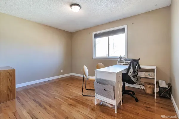 a workspace with wooden floor