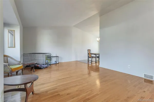 a room with furniture and wooden floor