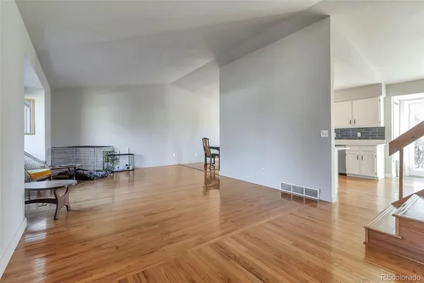 a view of a livingroom with wooden floor