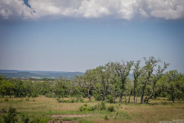 a view of lake with mountain in background