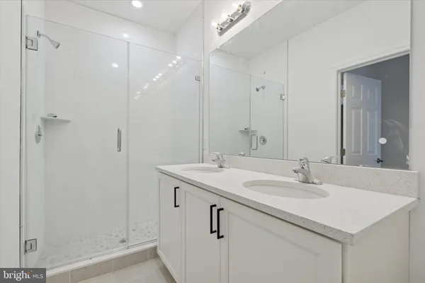 a bathroom with a sink and mirror
