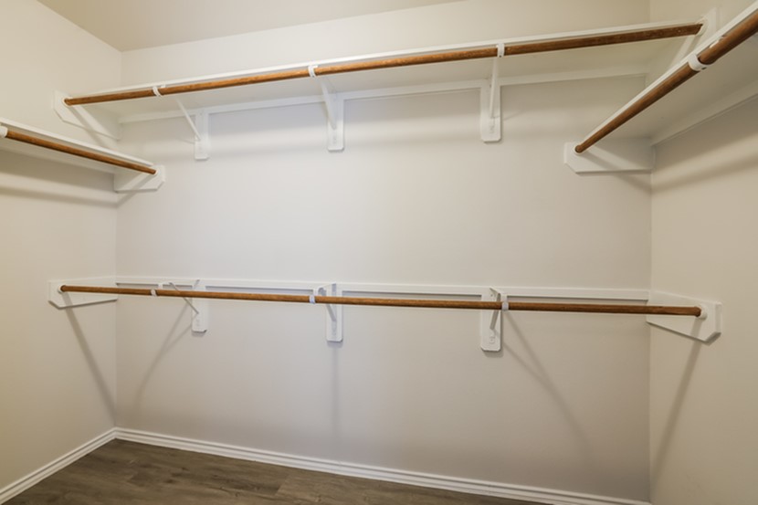 13816 Winding Path Lane Willis, TX 77378 - Photo 5 of 8 a view of a room with racks on the wall