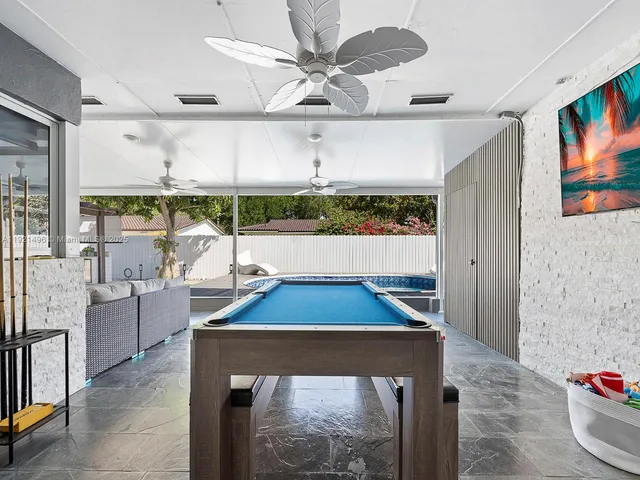 a view of a living room and a balcony