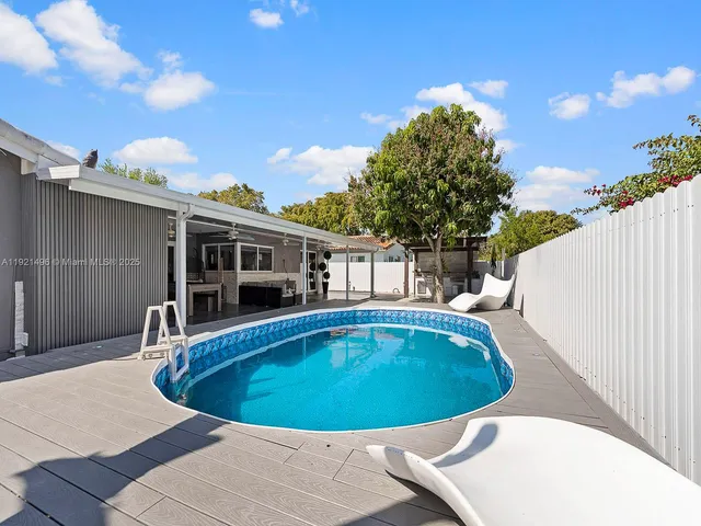 a view of outdoor space and swimming pool