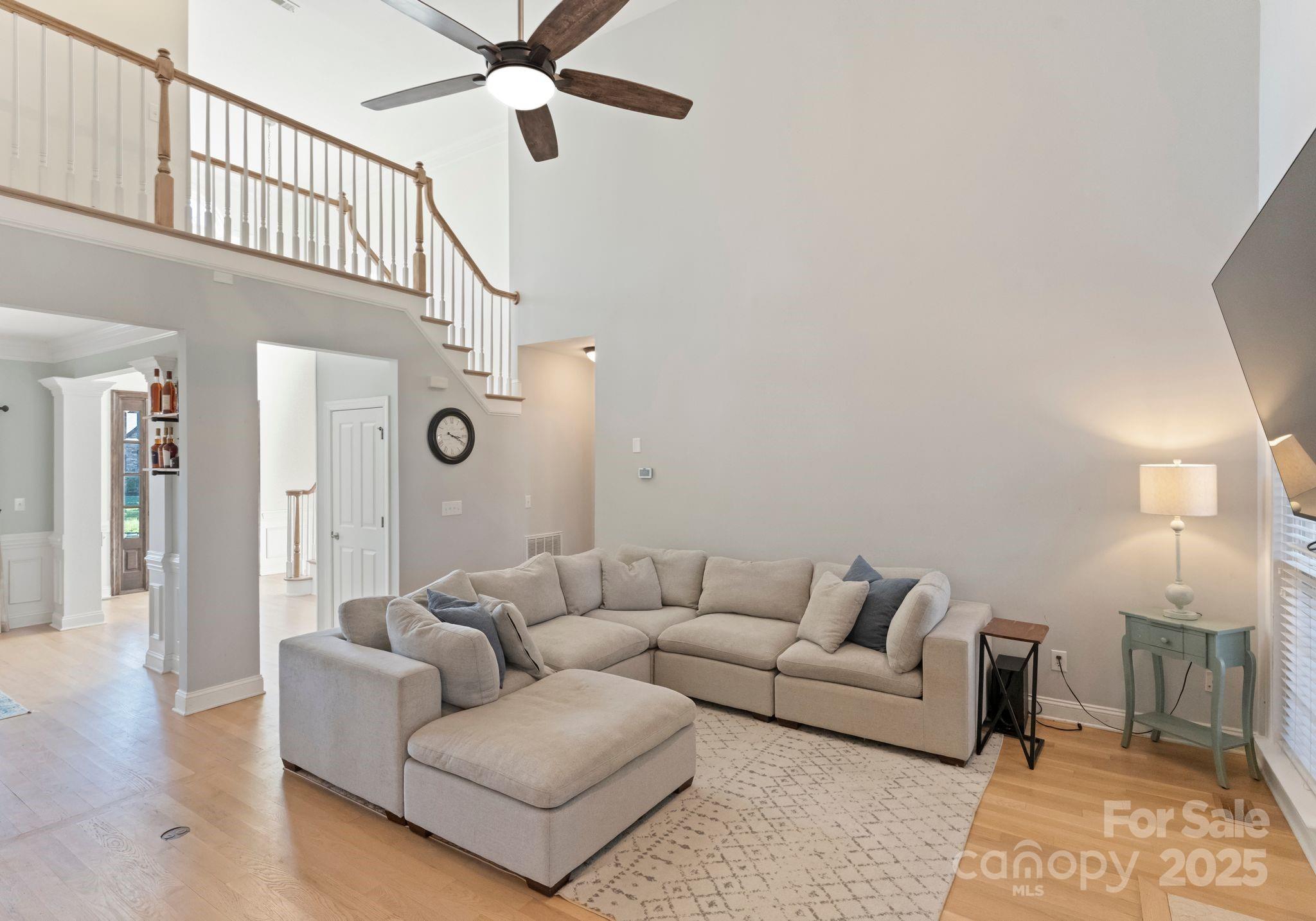 706 King Fredrick Lane Southwest Concord, NC 28027 - Photo 15 of 36 a living room with furniture and a ceiling fan