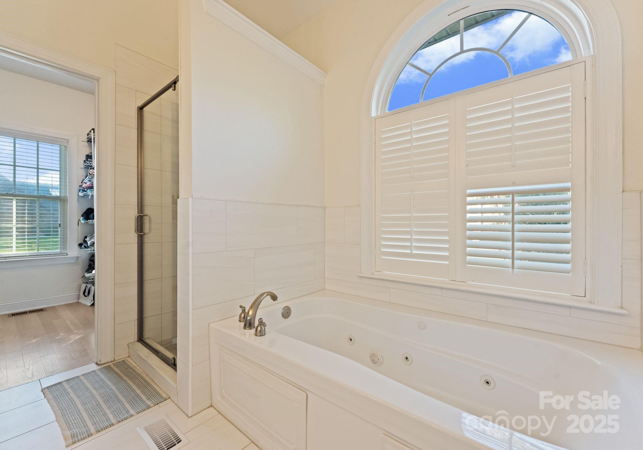 706 King Fredrick Lane Southwest Concord, NC 28027 - Photo 18 of 36 a bathroom with a bathtub and a shower