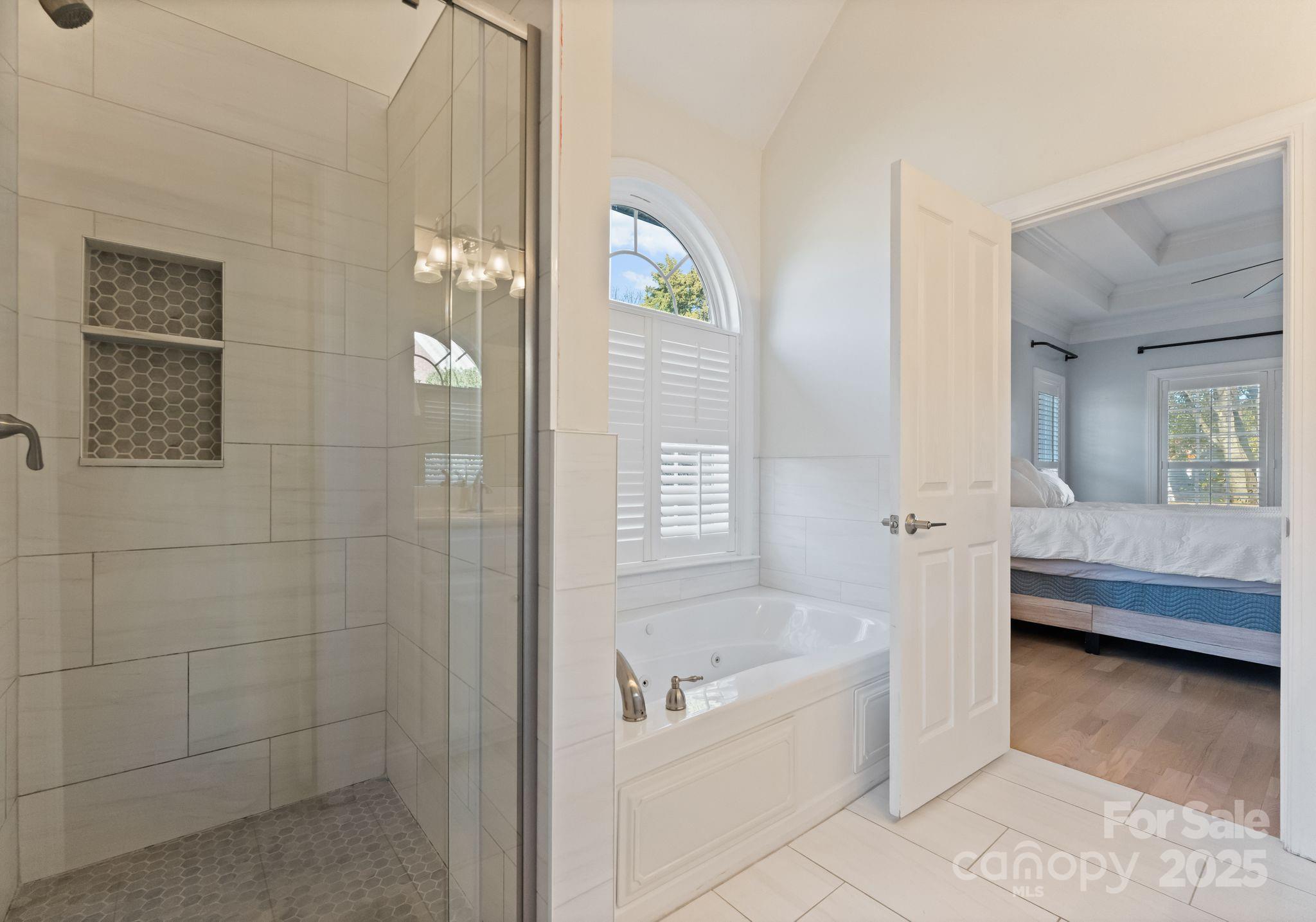 706 King Fredrick Lane Southwest Concord, NC 28027 - Photo 19 of 36 a bathroom with a tub shower and sink