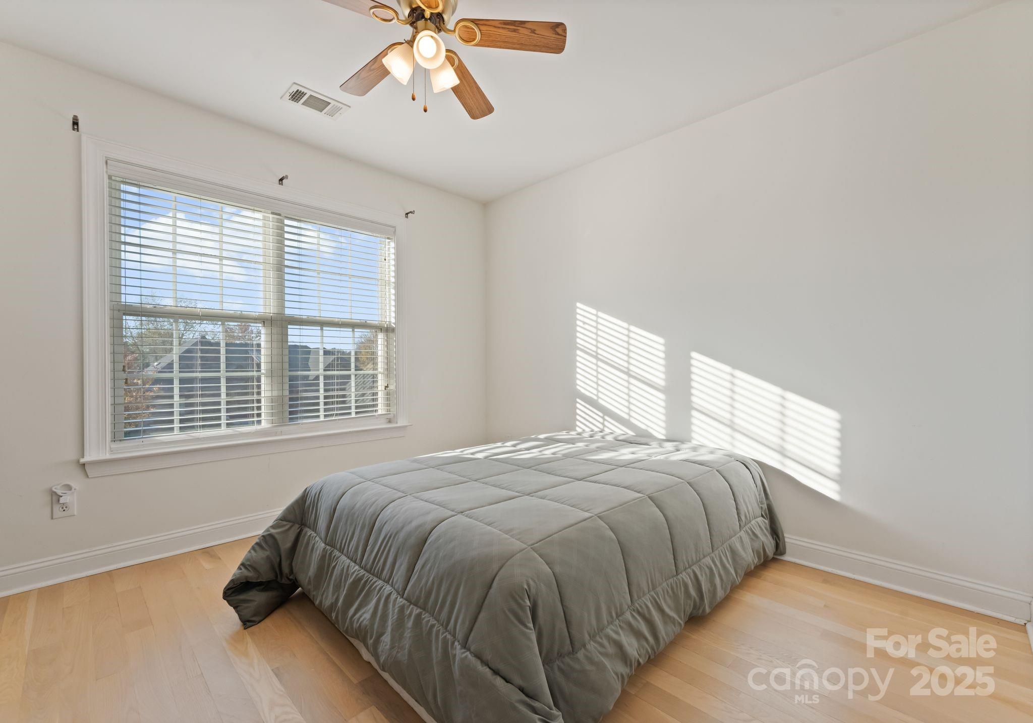 706 King Fredrick Lane Southwest Concord, NC 28027 - Photo 25 of 36 a bedroom with a bed and a window