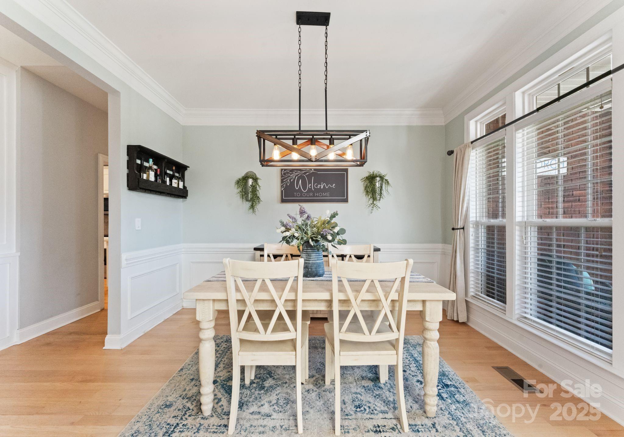 706 King Fredrick Lane Southwest Concord, NC 28027 - Photo 6 of 36 a view of a dining room with furniture window and wooden floor