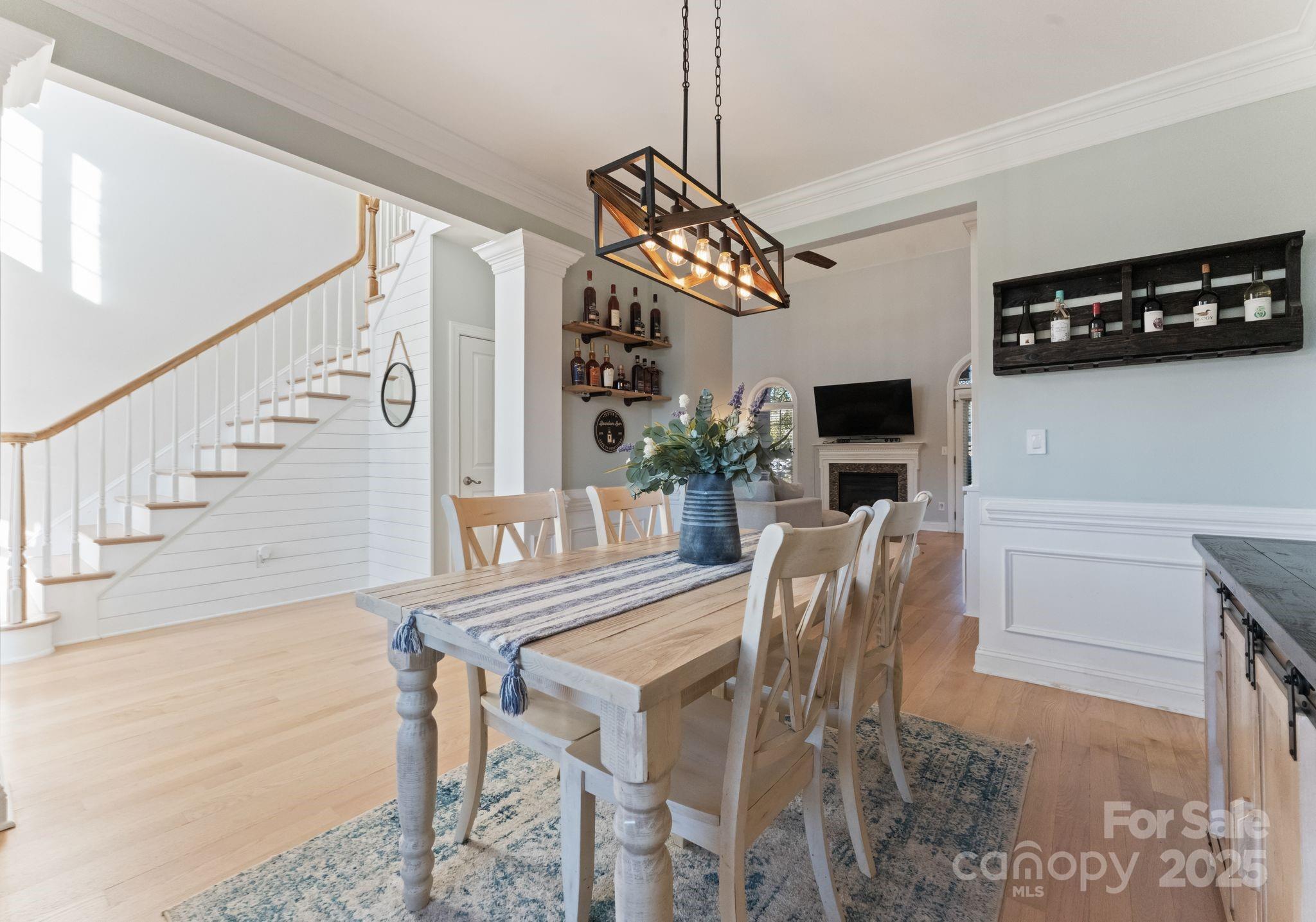 706 King Fredrick Lane Southwest Concord, NC 28027 - Photo 8 of 36 a view of a dining room with furniture and chandelier