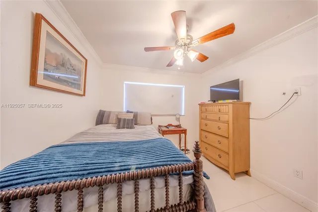 a bed room with a bed and a chandelier