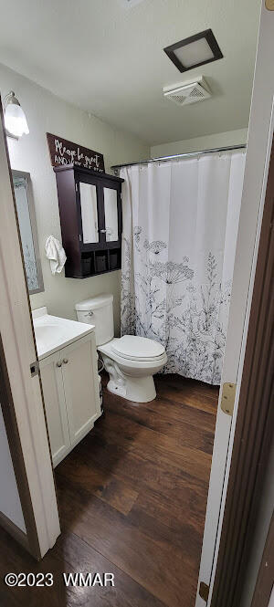 741 South 7th W Street Snowflake, AZ 85937 - Photo 21 of 41 a bathroom with a toilet sink and mirror