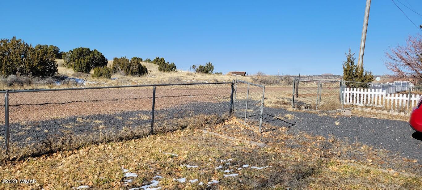741 South 7th W Street Snowflake, AZ 85937 - Photo 30 of 41 a view of a yard with wooden fence