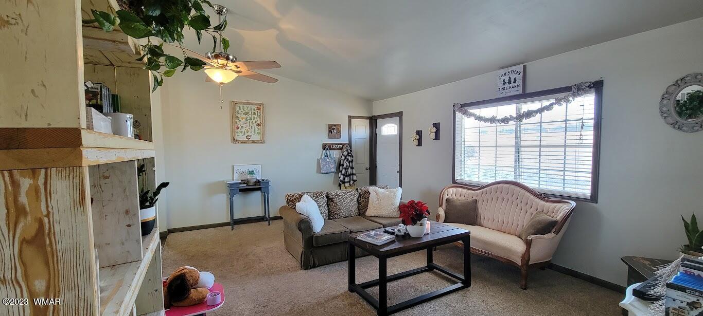 741 South 7th W Street Snowflake, AZ 85937 - Photo 3 of 41 a living room with furniture and a large window