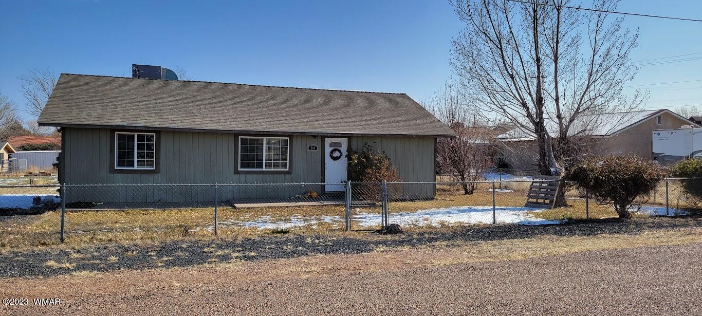 741 South 7th W Street Snowflake, AZ 85937 - Photo 41 of 41 a front view of a house with a yard
