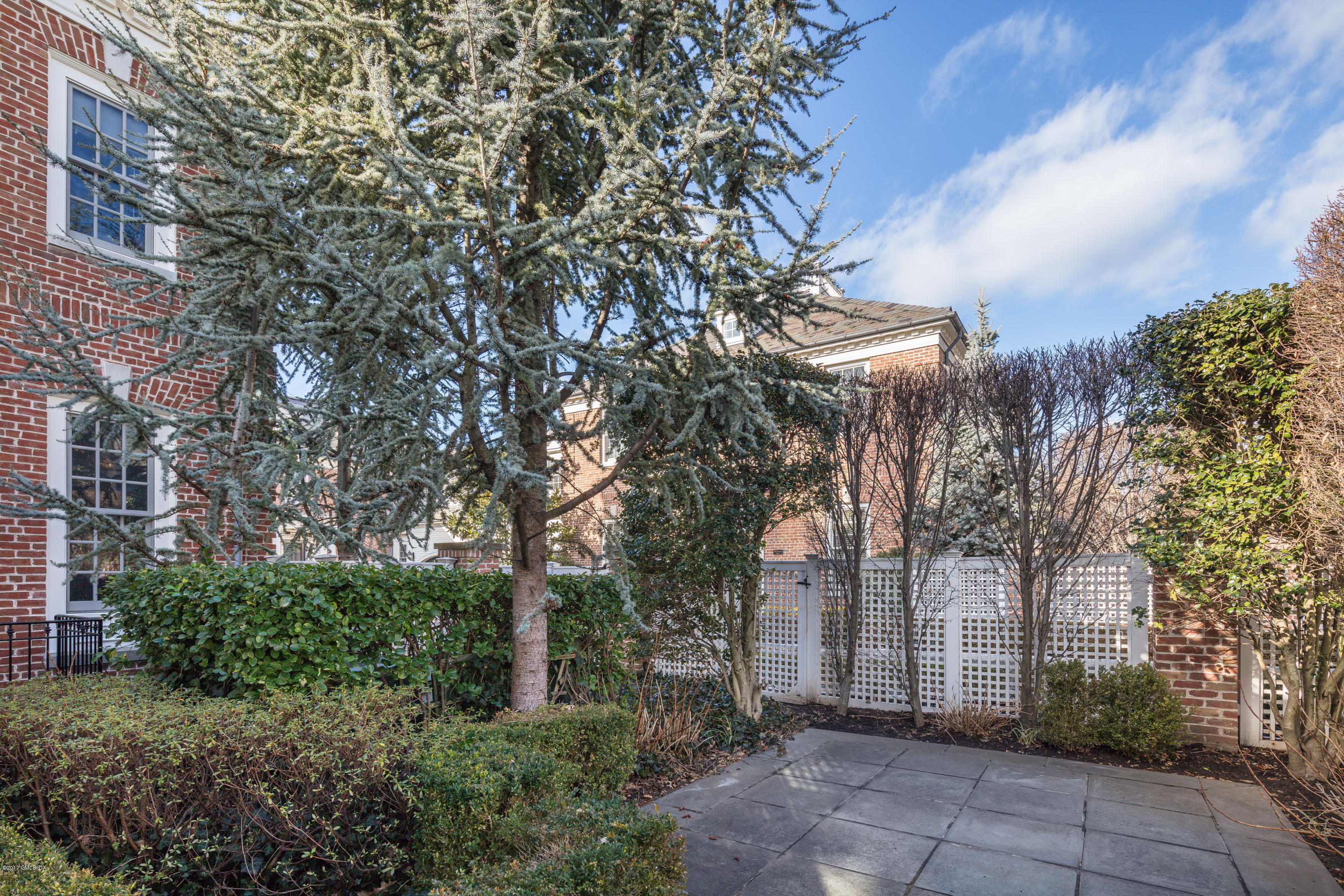 215 Milbank Avenue, Unit E Greenwich, CT 06830 - Photo 14 of 17 a view of a pathway with a house in background