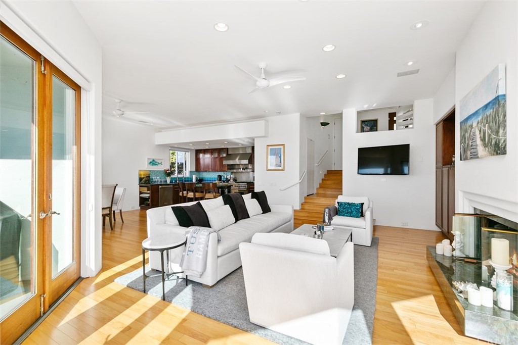 2485 Kilo Way Laguna Beach, CA 92651 - Photo 12 of 35 a living room with furniture a flat screen tv and a large window