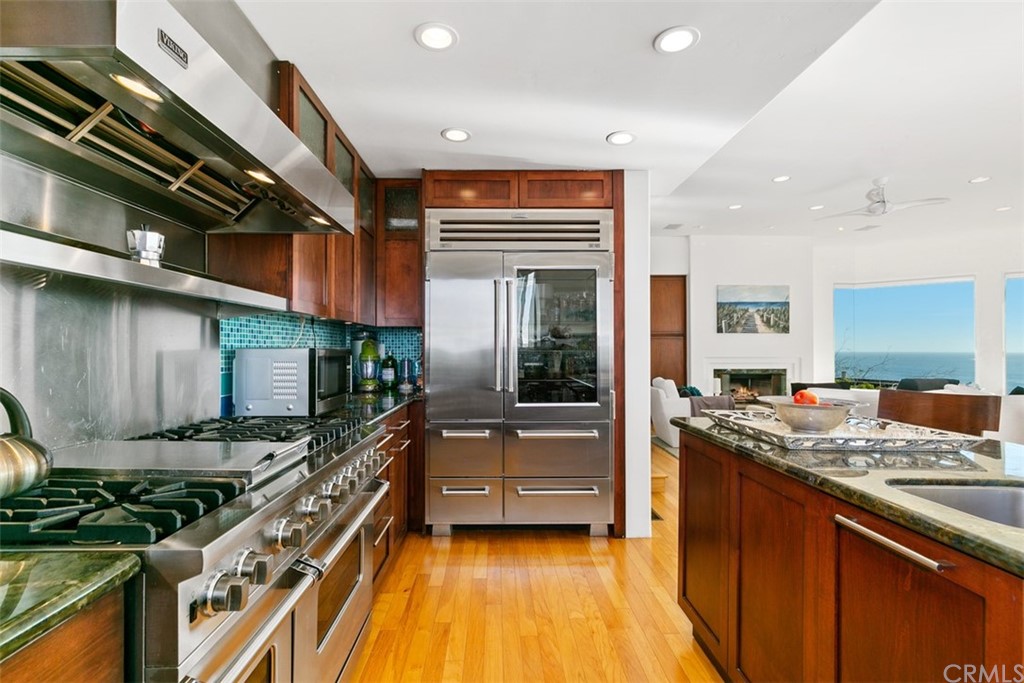 2485 Kilo Way Laguna Beach, CA 92651 - Photo 14 of 35 a kitchen with stainless steel appliances granite countertop a stove and a sink