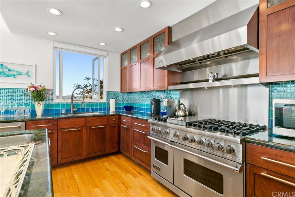 2485 Kilo Way Laguna Beach, CA 92651 - Photo 15 of 35 a kitchen with stainless steel appliances granite countertop a stove and a sink