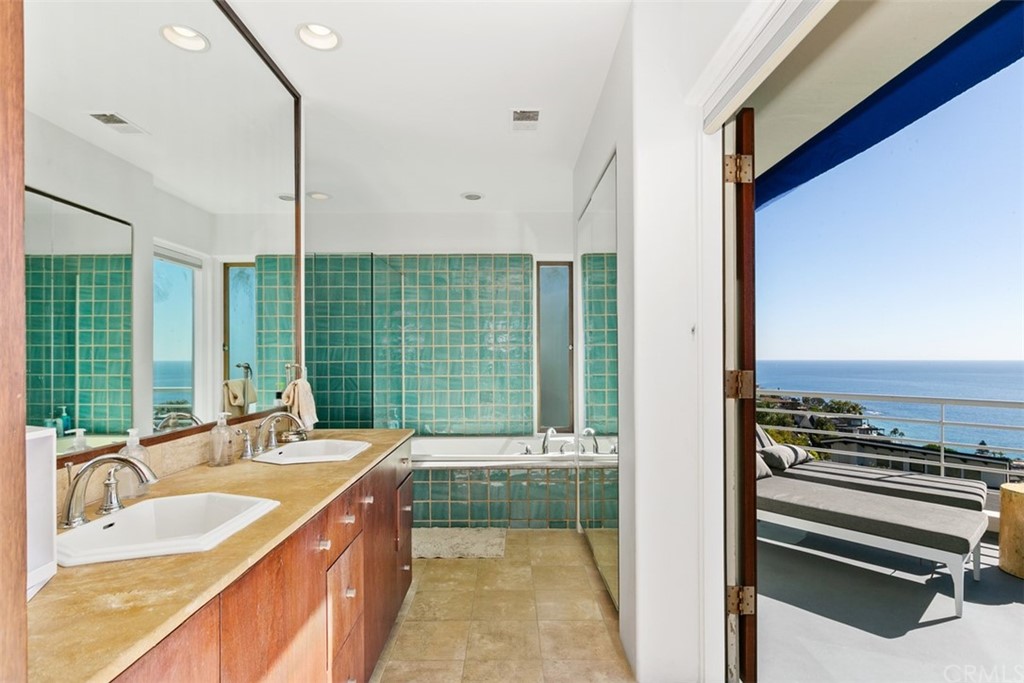 2485 Kilo Way Laguna Beach, CA 92651 - Photo 22 of 35 a bathroom with a tub sink and mirror