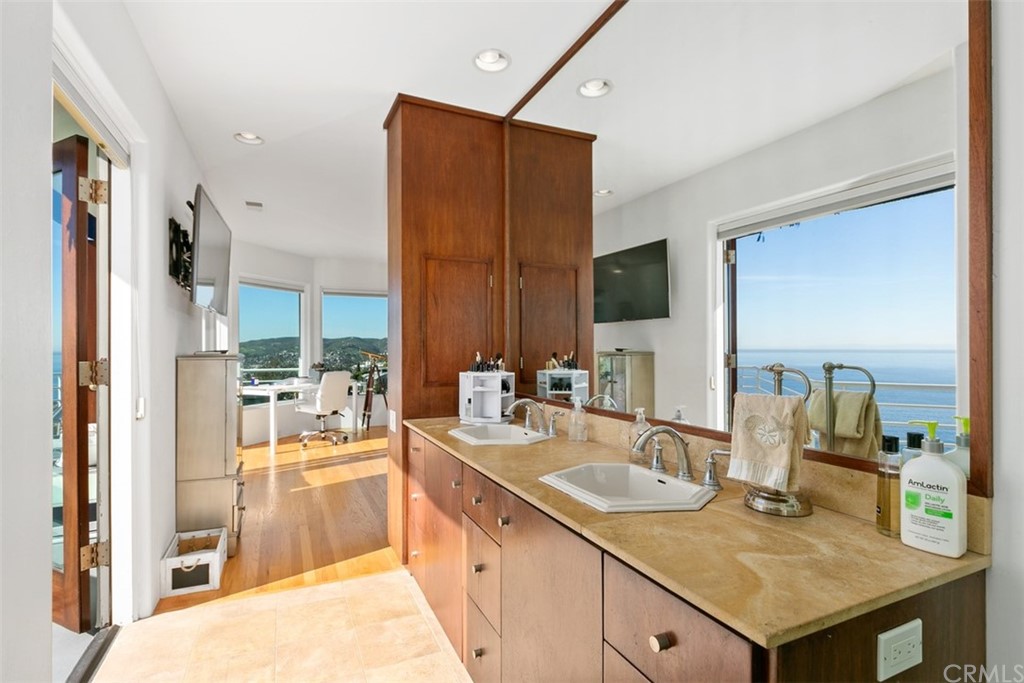 2485 Kilo Way Laguna Beach, CA 92651 - Photo 23 of 35 a kitchen with a sink refrigerator and cabinets