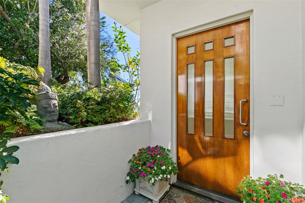 2485 Kilo Way Laguna Beach, CA 92651 - Photo 33 of 35 a flower garden in front of a door