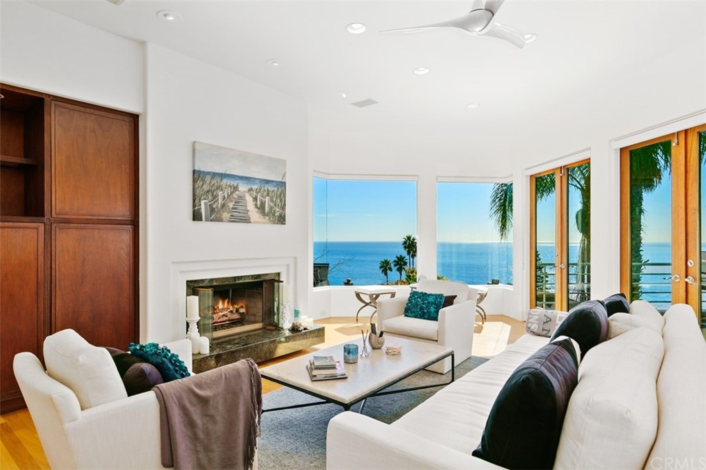 2485 Kilo Way Laguna Beach, CA 92651 - Photo 7 of 35 a living room with furniture fireplace and a large window