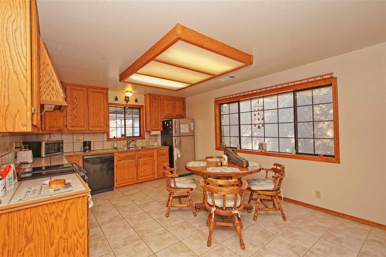 12455 Wilder Road Red Bluff, CA 96080 - Photo 12 of 73 a dining room with furniture and window