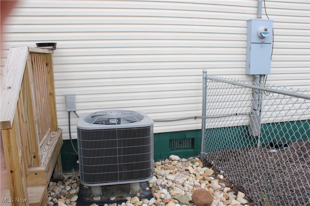 56 3rd Street Rayland, OH 43943 - Photo 16 of 46 Exterior view of crawl space and a central air condition unit