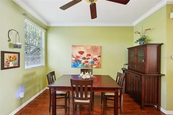 a living room with stainless steel appliances kitchen island granite countertop furniture and a refrigerator