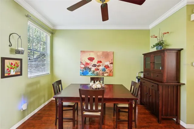a living room with stainless steel appliances kitchen island granite countertop furniture and a refrigerator