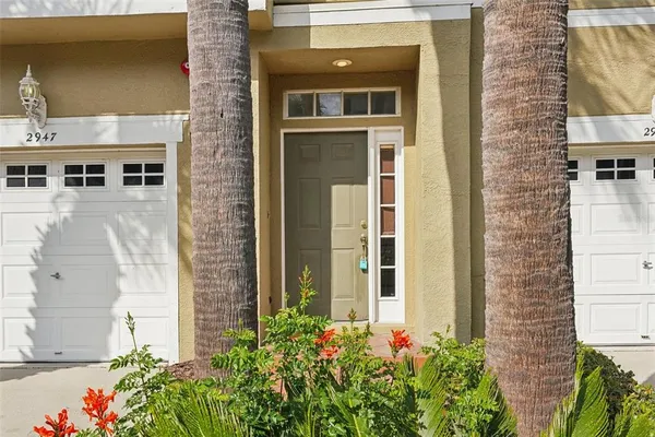 front view of a brick house with a yard
