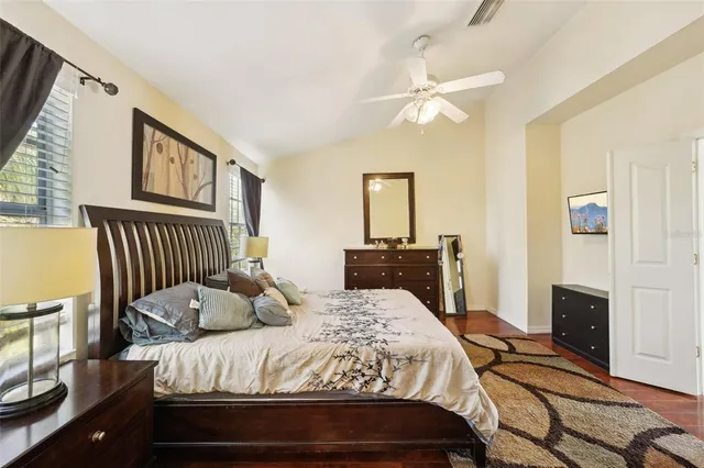 a view of a swimming pool with a garden and plants