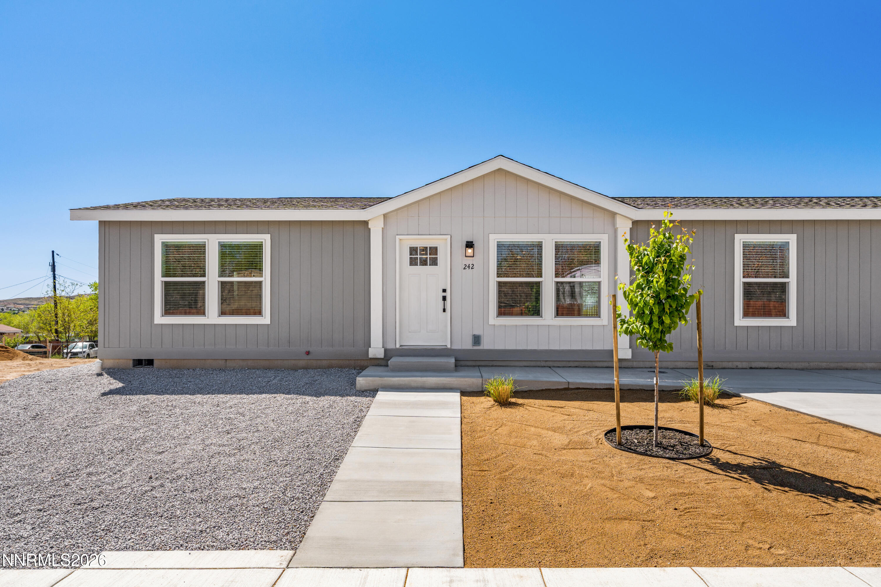 242 Caleb Court Sun Valley, NV 89433 - Photo 1 of 24 a house view with a outdoor space