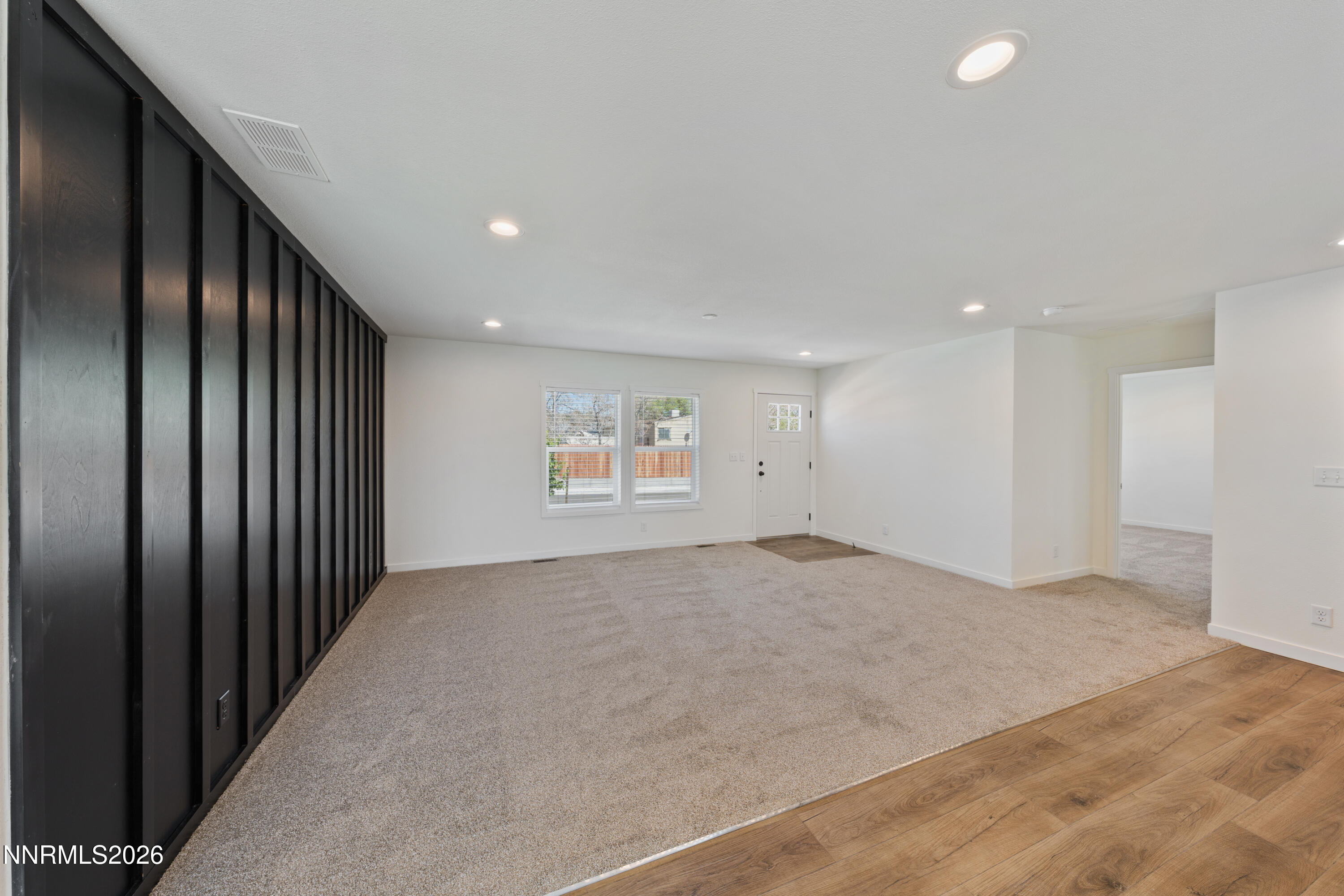 242 Caleb Court Sun Valley, NV 89433 - Photo 12 of 24 an empty room with windows