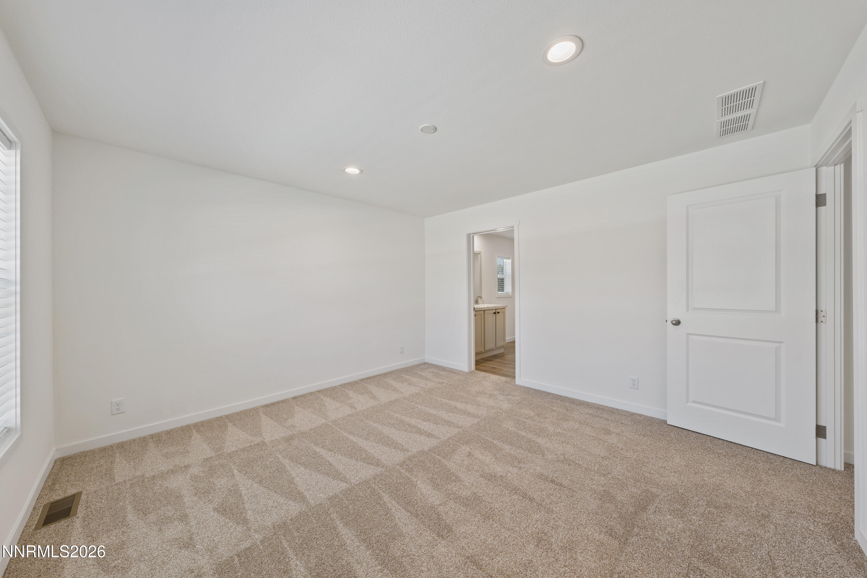 242 Caleb Court Sun Valley, NV 89433 - Photo 16 of 24 a view of an empty room