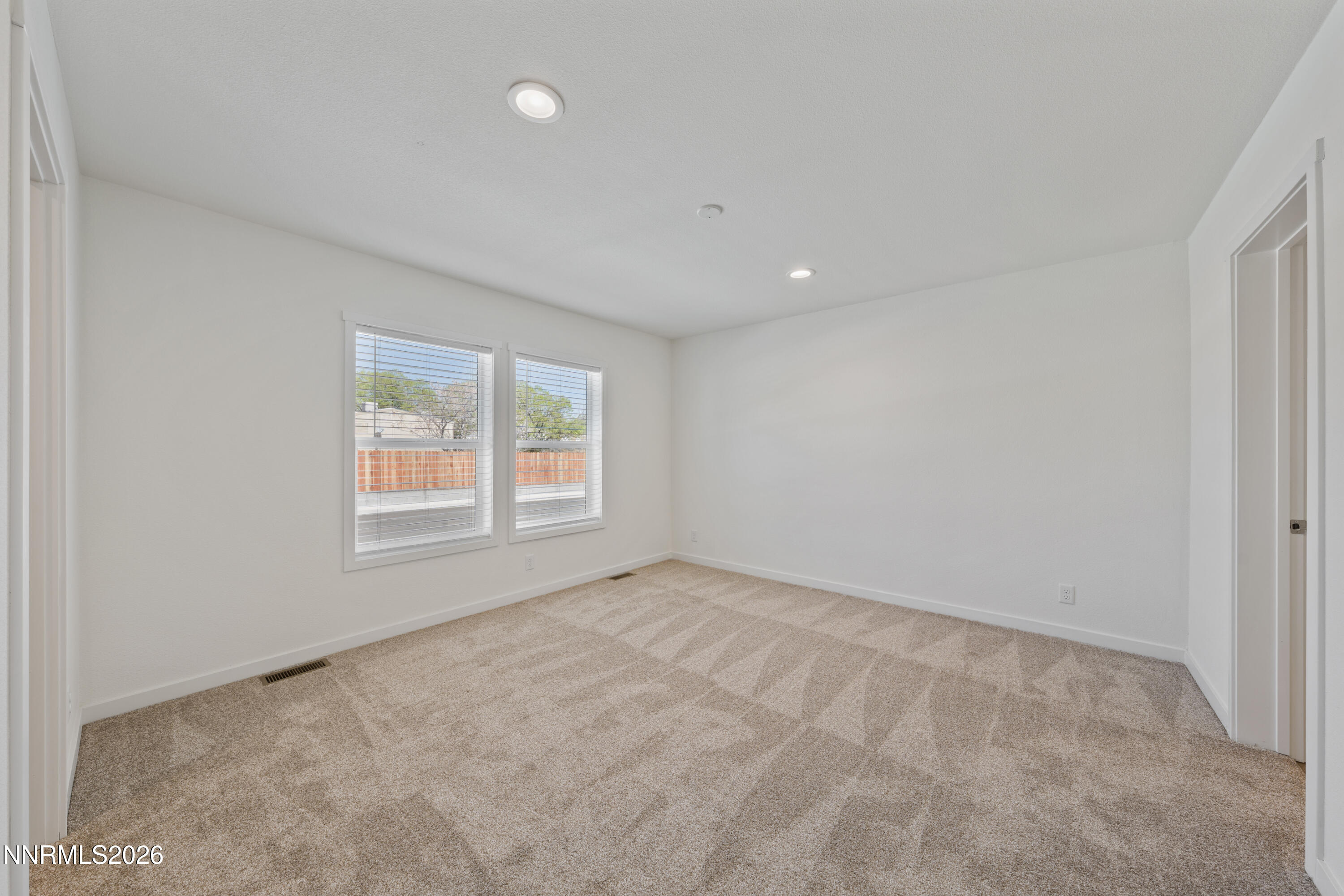 242 Caleb Court Sun Valley, NV 89433 - Photo 17 of 24 an empty room with a window
