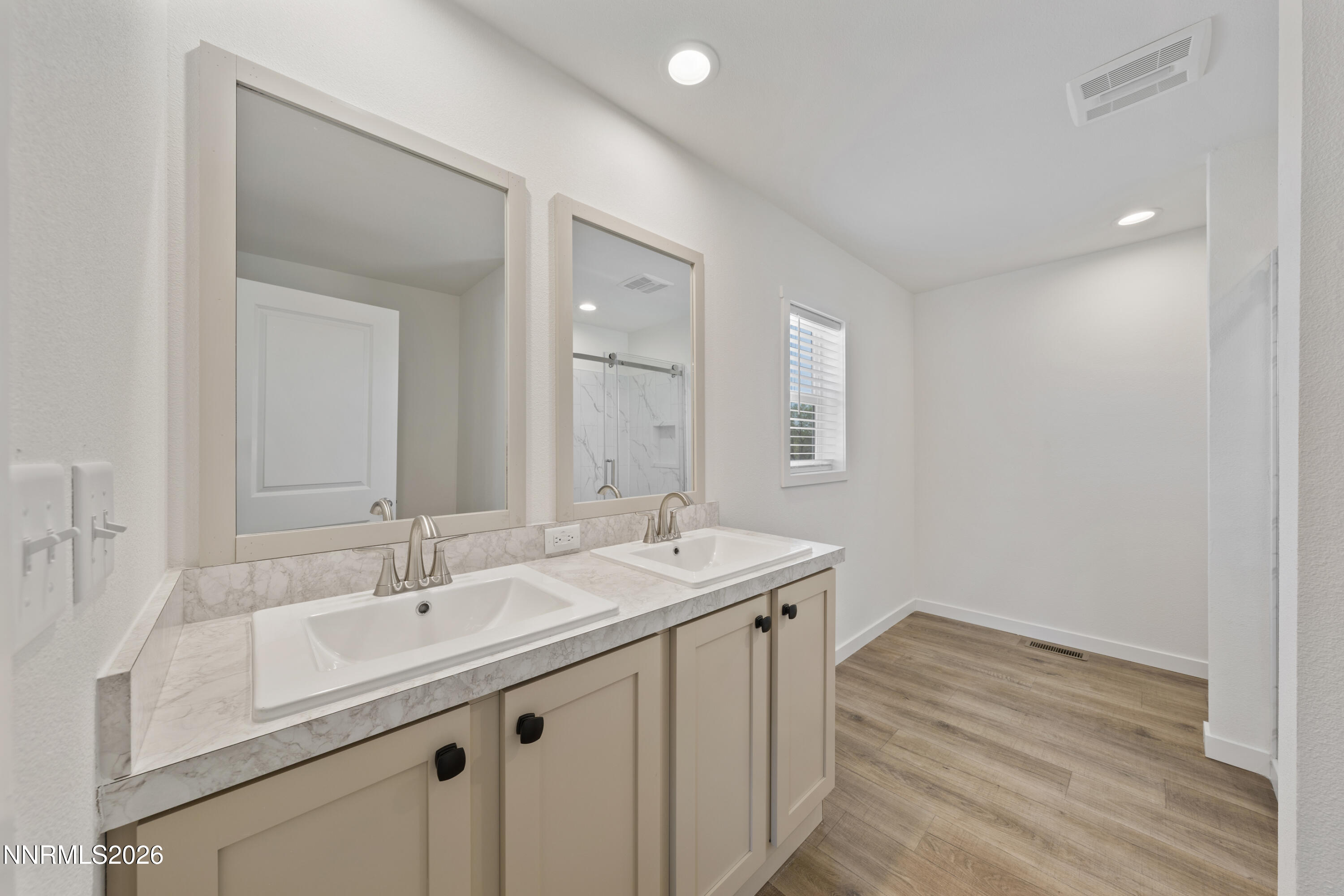 242 Caleb Court Sun Valley, NV 89433 - Photo 18 of 24 a bathroom with a sink and a mirror