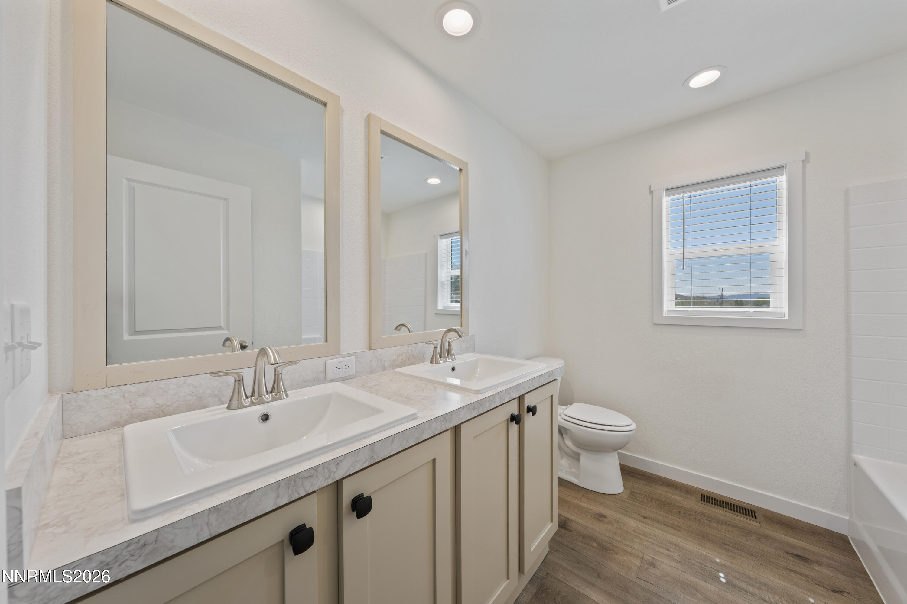 242 Caleb Court Sun Valley, NV 89433 - Photo 22 of 24 a bathroom with a sink and a toilet