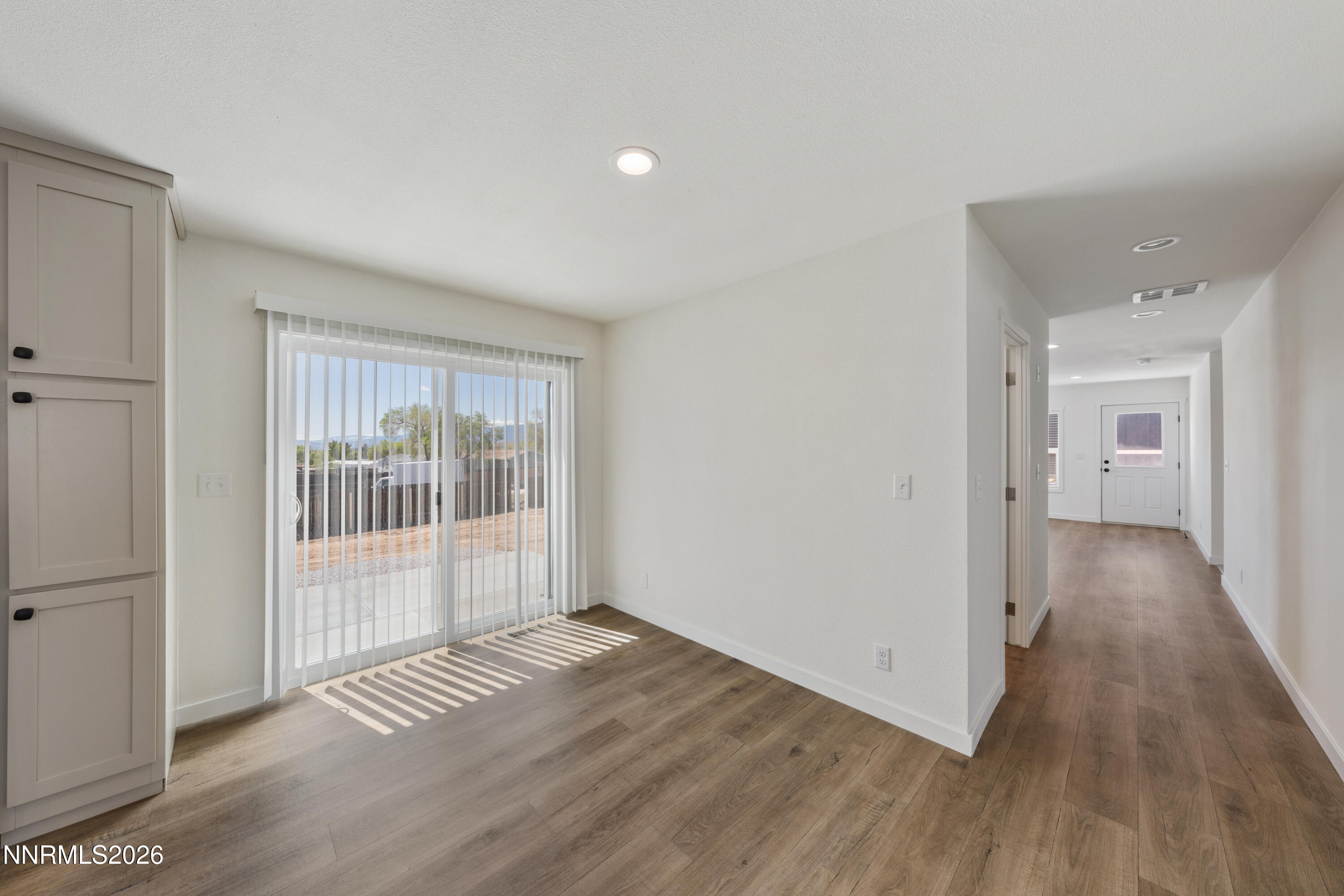 242 Caleb Court Sun Valley, NV 89433 - Photo 9 of 24 a view of a livingroom with wooden floor