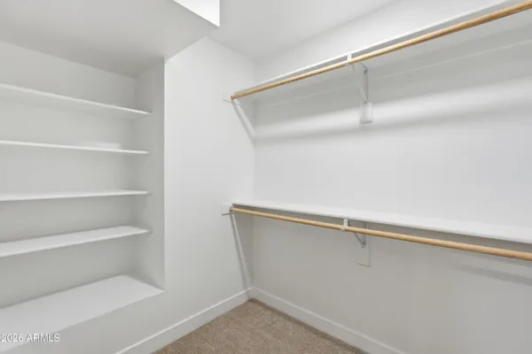 a view of an empty walk in closet
