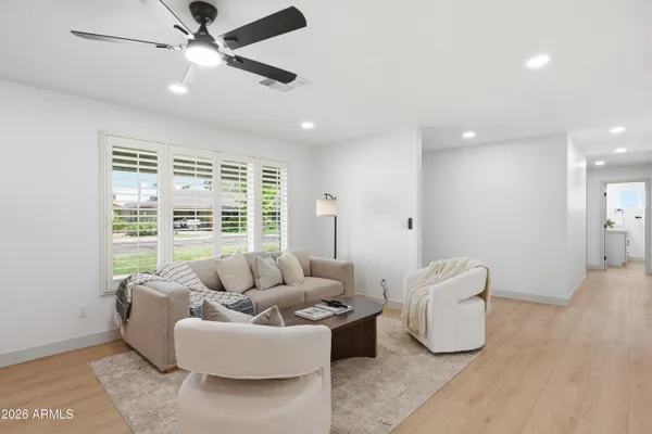 a living room with furniture and a large window