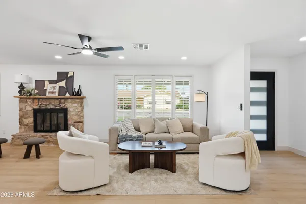 a living room with furniture and a large window