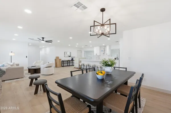 a view of a dining room with furniture and wooden floor