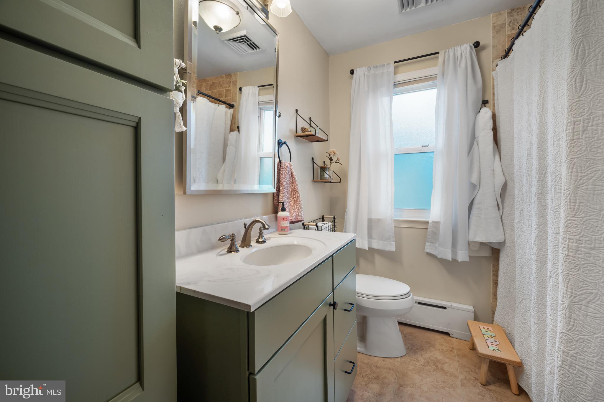 25 Meadowlark Road Stratford, NJ 08084 - Photo 18 of 27 a bathroom with a sink toilet and shower