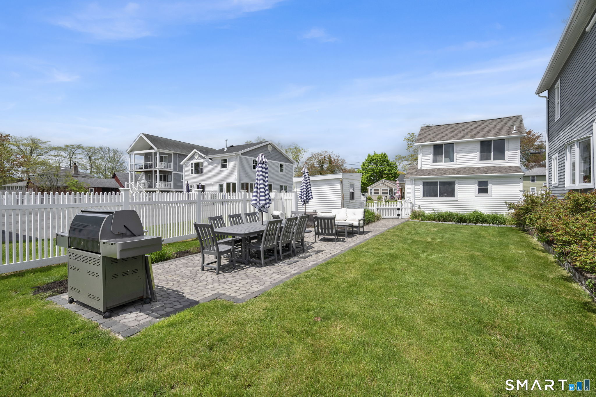96 Chalker Beach Road Old Saybrook, CT 06475 - Photo 10 of 33 a view of a house with backyard porch and sitting area