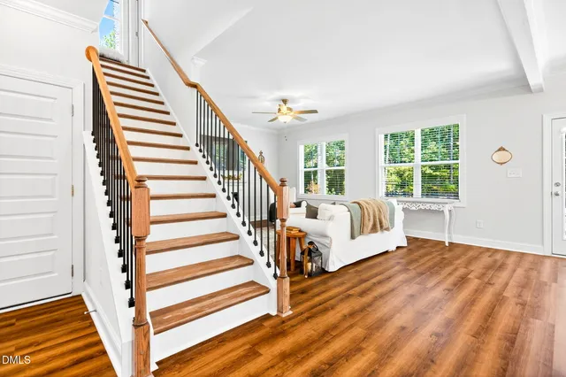 a living room with furniture fireplace and window