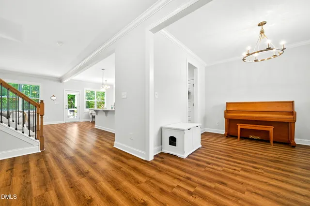 a view of a livingroom with furniture and staircase
