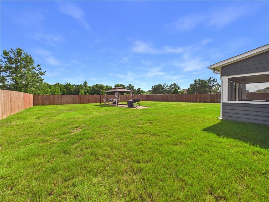 52 Owens Road Fort Mitchell, AL 36856 - Photo 29 of 29 Expansive grassy yard enclosed by a wood privacy fence